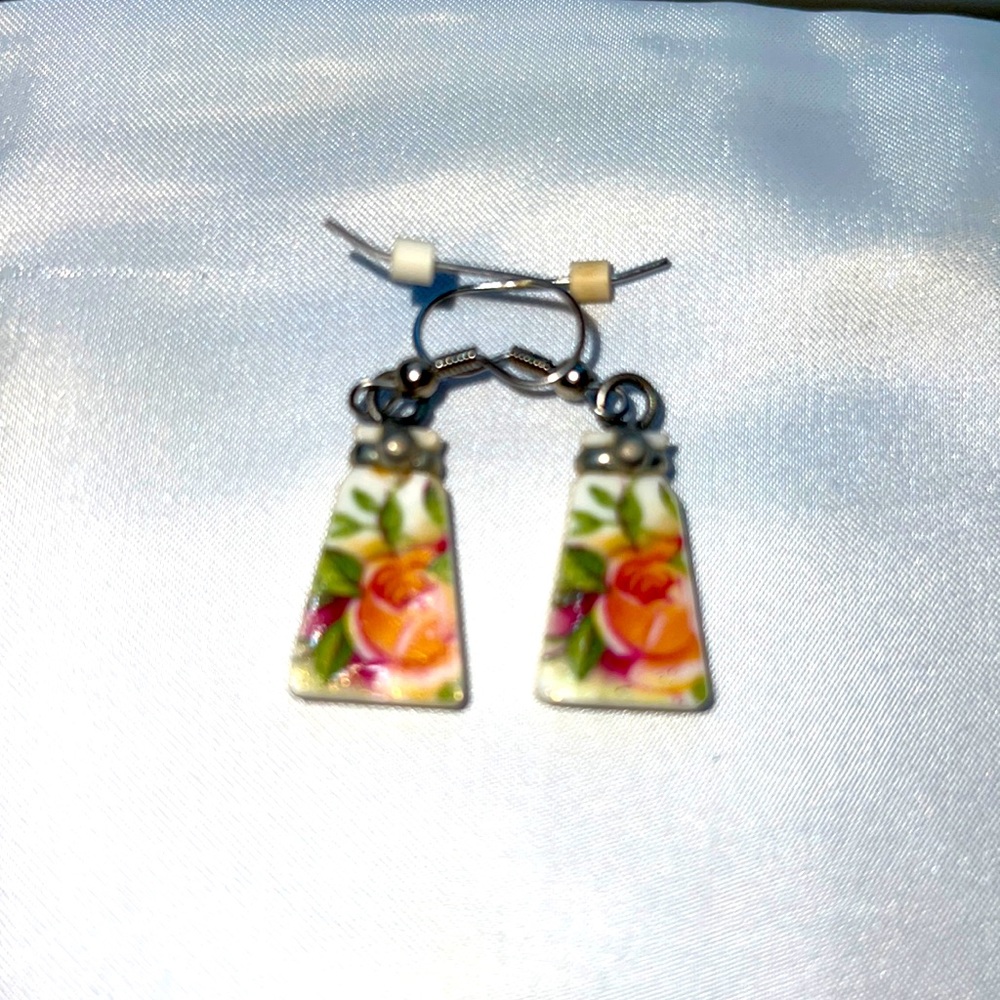 Earrings with peach colored flowers